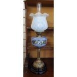 Victorian oil lamp with glass shade and pale blue opaque glass well painted with daisies, on a brass