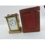 Brass carriage timepiece in plain case, with red leather-bound travelling case, 15cm high