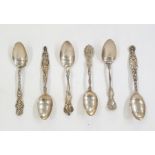 Six various ornate sterling white metal spoons, some with Art Nouveau decoration, possibly