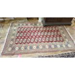 20th century Persian rug, the red ground central field with three rows of 13 elephant foot cream