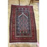 Persian prayer rug, the black ground central field with repeating pattern, on a stepped border,