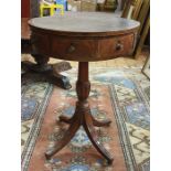 19th century mahogany centre drum table, the circular top with black embossed leather above four