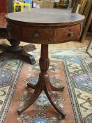 19th century mahogany centre drum table, the circular top with black embossed leather above four