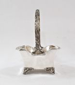 Edwardian silver basket, shaped rectangular with serpentine edge, laurel wreath handle, on four