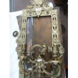 Pair of elaborate brass-framed rectangular mirrors with two-branch candle sconces (mirrors