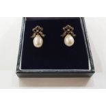 Pair of white and yellow metal, diamond and pearl drop earrings, each with diamond set bow and