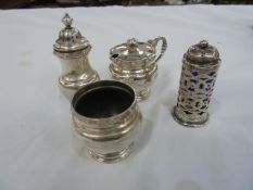 A three piece silver cruet set, each with relief border, Birmingham 1947 and 1948 and a silver
