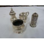 A three piece silver cruet set, each with relief border, Birmingham 1947 and 1948 and a silver