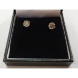 Pair 18ct white gold and diamond stud earrings, each circular claw set, 3.07ct total approx