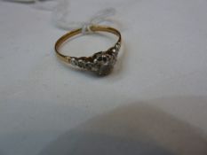 18ct gold solitaire diamond ring set single claw-set stone with small diamonds to the shoulders (