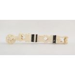 Carved bone prisoner of war pastry jigger, pierced with hearts and diamonds, banded in black, 18cm