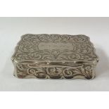 Silver-coloured metal snuff box, shaped rectangular, with foliate scroll engraved decoration