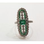 Platinum, emerald and diamond Art Deco style ring, the elongated oval set with central emerald