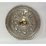 Indian/Burmese silver circular salver embossed with human figures and animals and a pierced floral