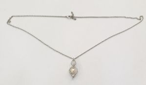 Mikimoto 18ct white gold, diamond and pearl pendant in the form of two open teardrops, set with