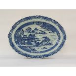 Chinese porcelain shallow dish, oval with everted rim, pagodas in lakeside landscape painted in