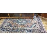Red ground Persian rug with central foliate stepped medallion, the red ground field foliate