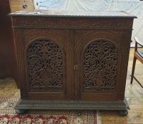 Eastern hardwood Anglo-Indian style cupboard, the rectangular top with applied egg and dart