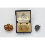 Antique pinchbeck and citrine brooch, shaped oval, set with seven oval cut claw-set stones, in