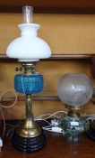 Oil lamp converted to electricity, with a turquoise glass ribbed bowl, on a fluted brass column