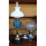 Oil lamp converted to electricity, with a turquoise glass ribbed bowl, on a fluted brass column