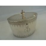 George III silver neoclassical oval tea caddy, with urn shaped finial, garland engraved borders, the