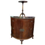 20th century mahogany two-door cocktail cabinet in the Eastern taste, on three cabriole supports and
