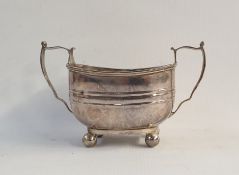 Silver sugar bowl of rectangular form ,with twin handles, raised on ball feet, Sheffield 1917,