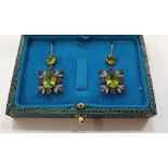 Pair of yellow and white metal, peridot, amethyst and diamond drop earrings, each with circular