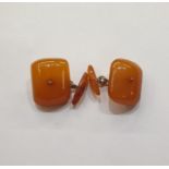 Pair amber-coloured rectangular cushion and torpedo-pattern cufflinks