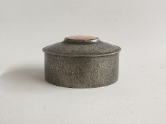 Small Liberty Tudric pewter hinged trinket box with a mother-of-pearl inset to lid, no. 0649, 9cm