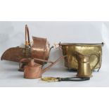 Large brass coal bucket with swing metal handle, on three supporting feet and a helmet copper coal