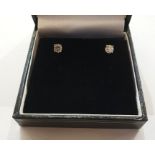 14ct white gold and diamond studs, the circular claw set stones 0.65ct total approx with screw-