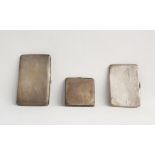 Three 20th century silver cigarette cases with engine-turned decoration, 13.3ozt (3)