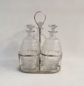 Georgian silver three-section decanter stand with reeded loop handle, three circular reeded holders,