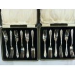 Two sets of six silver cake forks, wheatear pattern, each cased, Birmingham 1928