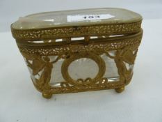 French gilt metal and glass casket, rounded rectangular, with pierced borders, applied with