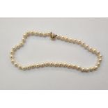 String of cultured pearls with 18ct white and yellow gold ball-pattern clasp, 46cm long