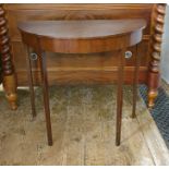 Late 19th/early 20th century mahogany side table of demi-lune form, on four square section