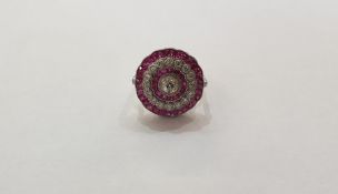 Platinum, diamond and ruby flowerhead design ring set with central old-cut diamond and further row