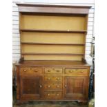 18th/19th century oak dresser with ogee moulded pediment above the three shelves, base of three