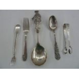 Assorted silver and white metal items to include Georgian sugar nips with bright-cut decoration, a