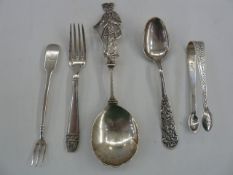 Assorted silver and white metal items to include Georgian sugar nips with bright-cut decoration, a