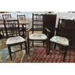 Four 19th century oak dining chairs with spindle backs and matching carver chair on turned