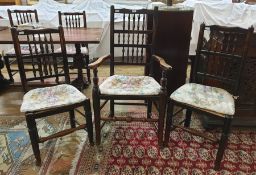 Four 19th century oak dining chairs with spindle backs and matching carver chair on turned