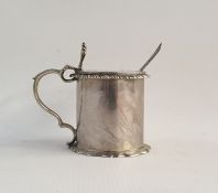 Silver circular mustard pot with hinged cover, blue glass liner, gadrooned border and spoon,