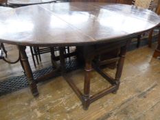 18th century oak gateleg dining table, the oval top with drop leaves, on base with turned