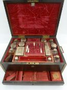 19th century coromandel vanity box fitted with glass and plate mounts, red velvet lining to the