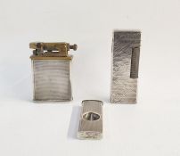 Dunhill lighter, another lighter marked 'Sterling Silver' and a silver cigar cutter (3)