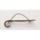 Continental white metal, pink and white stone shepherd's crook brooch set with multiple graduated